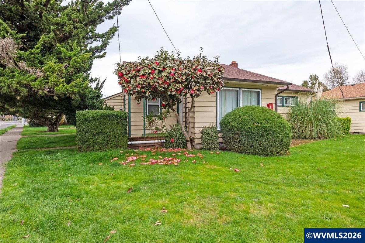 1735 Market Street Northeast Salem, OR 97301 - Photo 5 of 11 a front view of a house with a garden