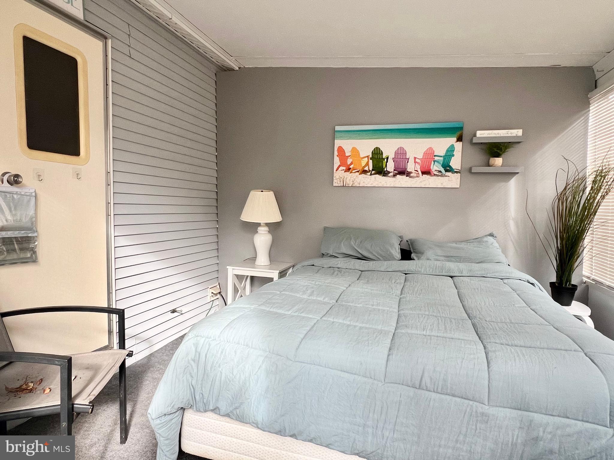 709 Seashore Road, Unit 626 Cape May, NJ 08204 - Photo 14 of 29 a bedroom with a bed and a flat screen tv