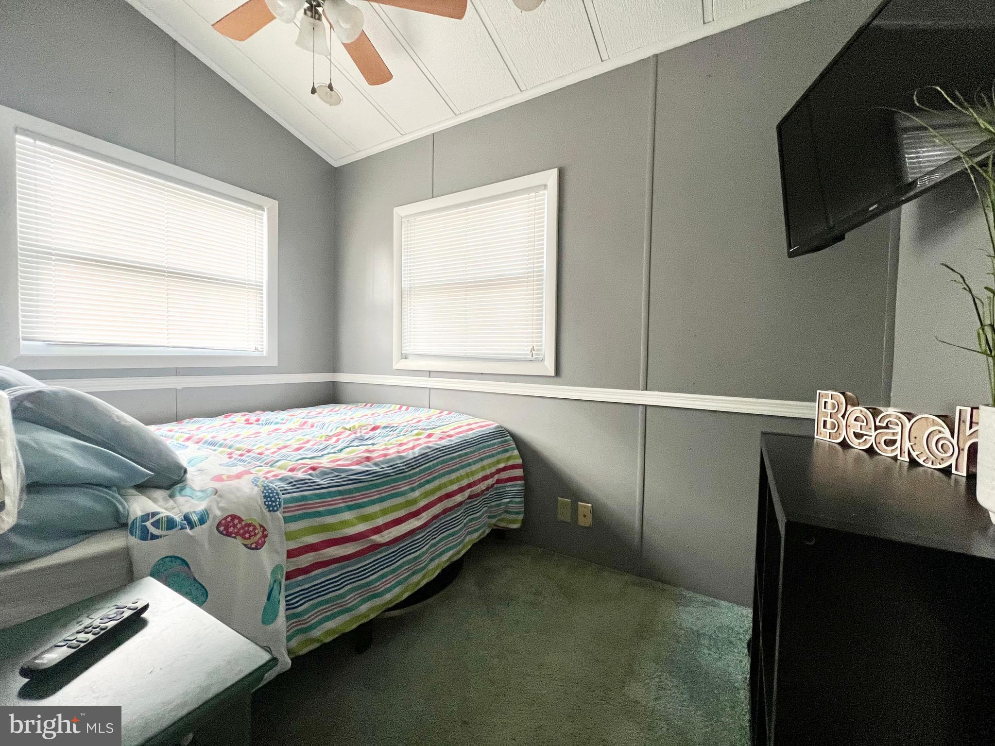 709 Seashore Road, Unit 626 Cape May, NJ 08204 - Photo 17 of 29 a bedroom with a bed and flat screen tv