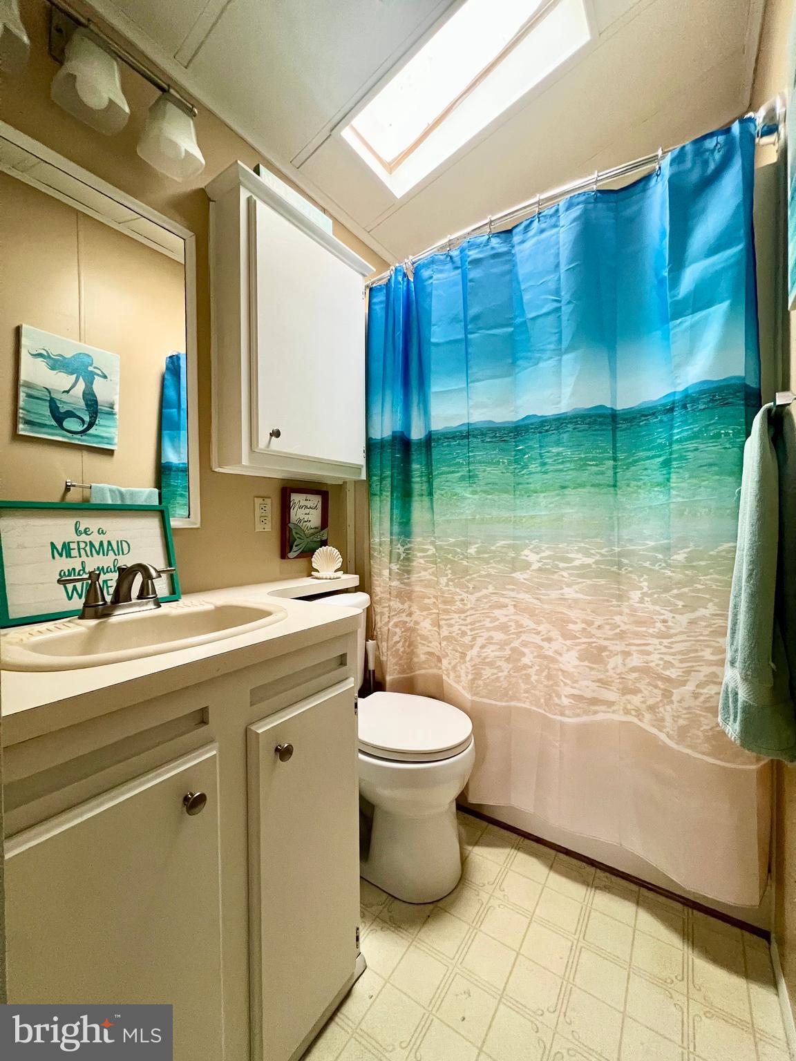 709 Seashore Road, Unit 626 Cape May, NJ 08204 - Photo 19 of 29 a bathroom with a sink a toilet and shower