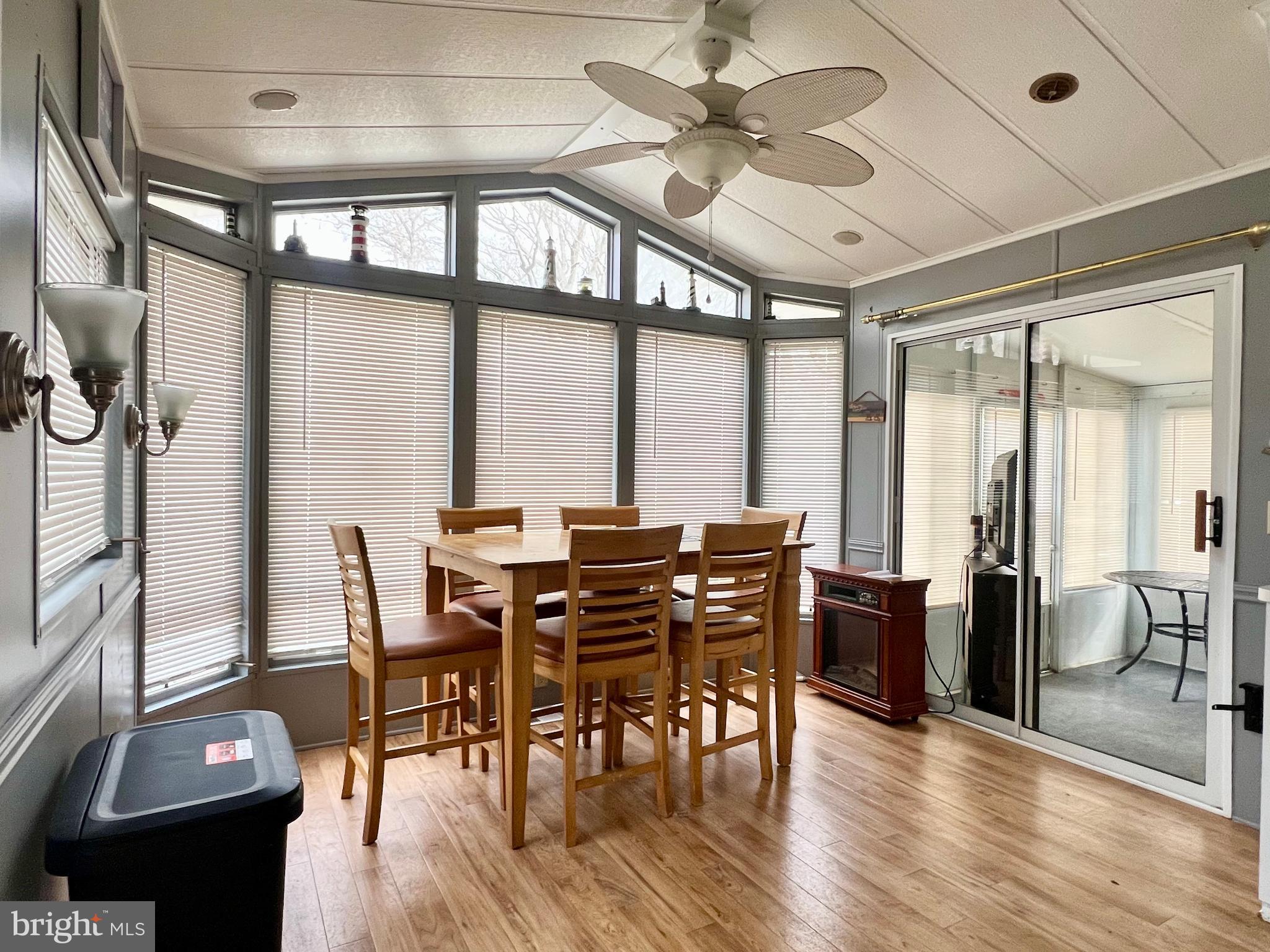 709 Seashore Road, Unit 626 Cape May, NJ 08204 - Photo 9 of 29 a view of a dining room with furniture window and wooden floor