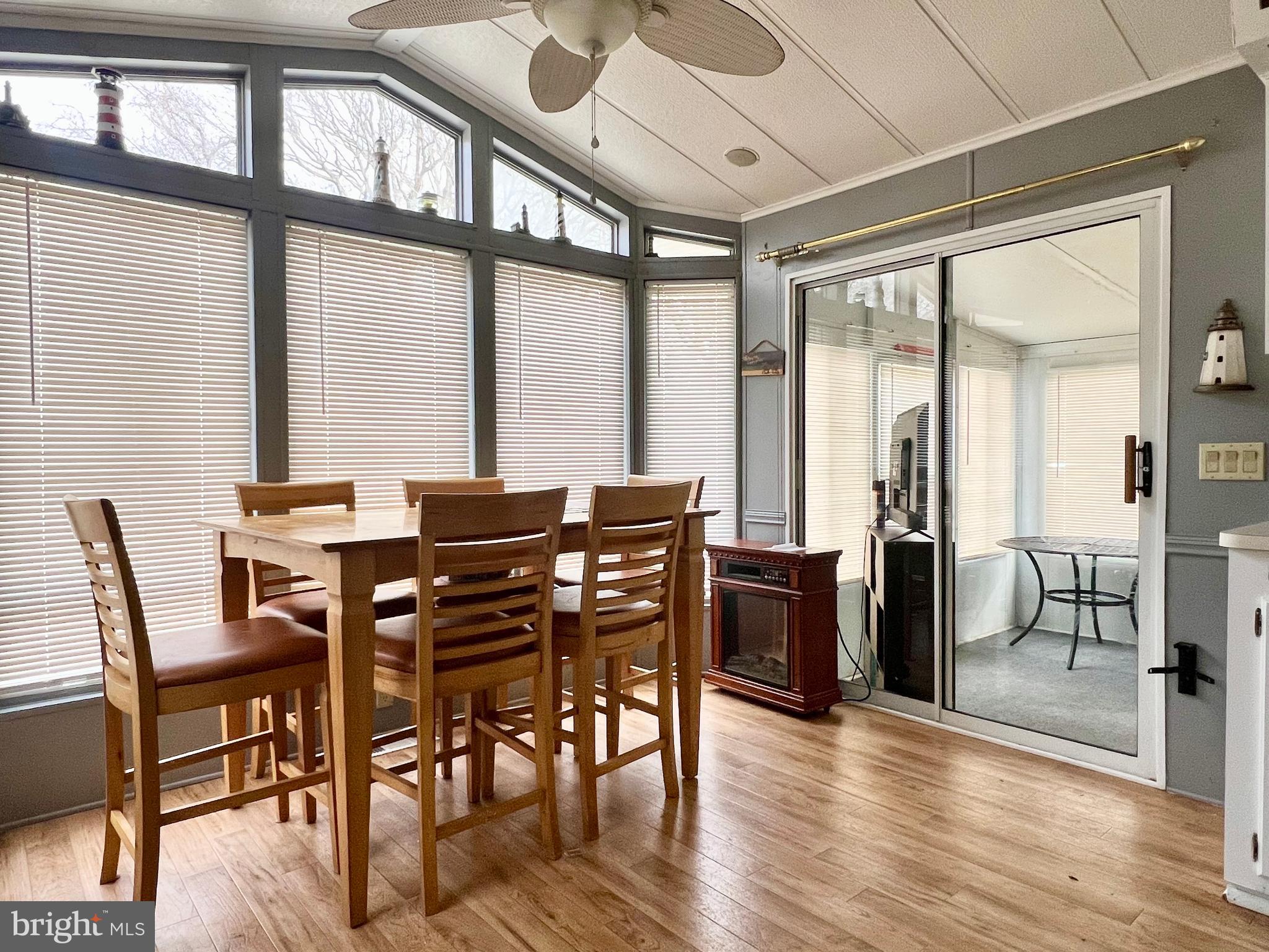 709 Seashore Road, Unit 626 Cape May, NJ 08204 - Photo 10 of 29 a view of a dining room with furniture window and wooden floor