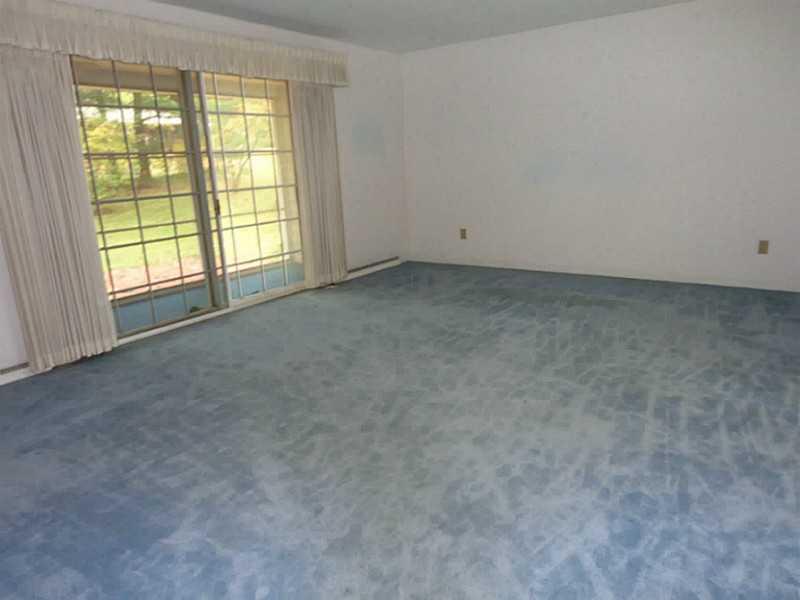 695 Koonce Road Hermitage, PA 16148 - Photo 3 of 25 Living Room. View of the living room with patio doors to deck