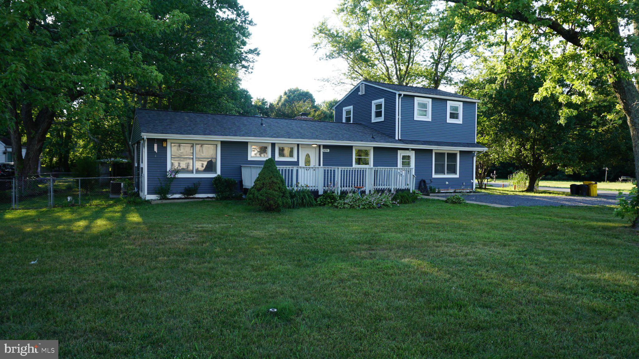 5854 Deale Churchton Road Deale, MD 20751 - Photo 4 of 57 Charming home with lush green surroundings.