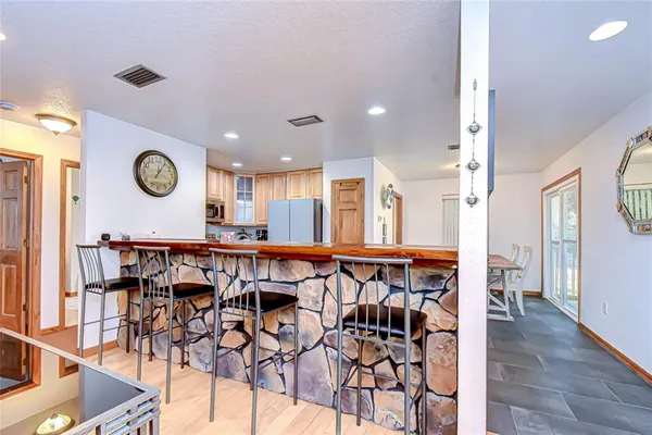 a view of an chairs and table in a room