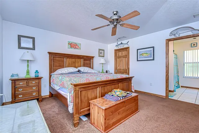 a bed room with a bed and a dresser