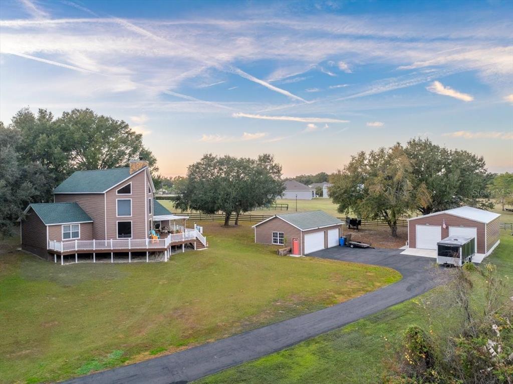 3719 Moores Lake Road Dover, FL 33527 - Photo 2 of 29 a view of a house with pool and sitting area