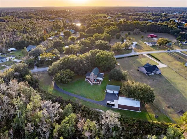 an aerial view of a house with a garden