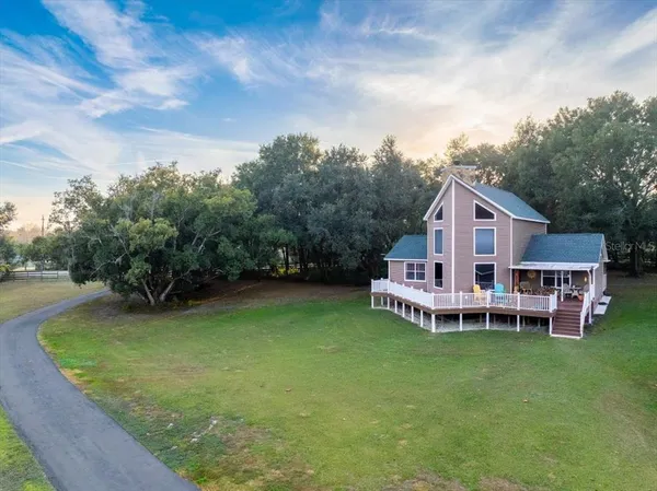 an aerial view of a house with a garden and a small yard
