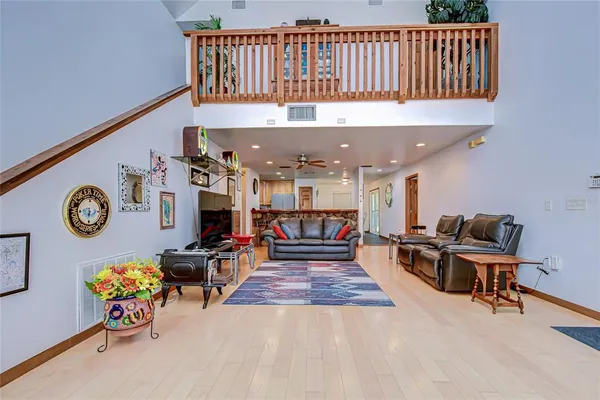 a living room with lots of furniture and a clock