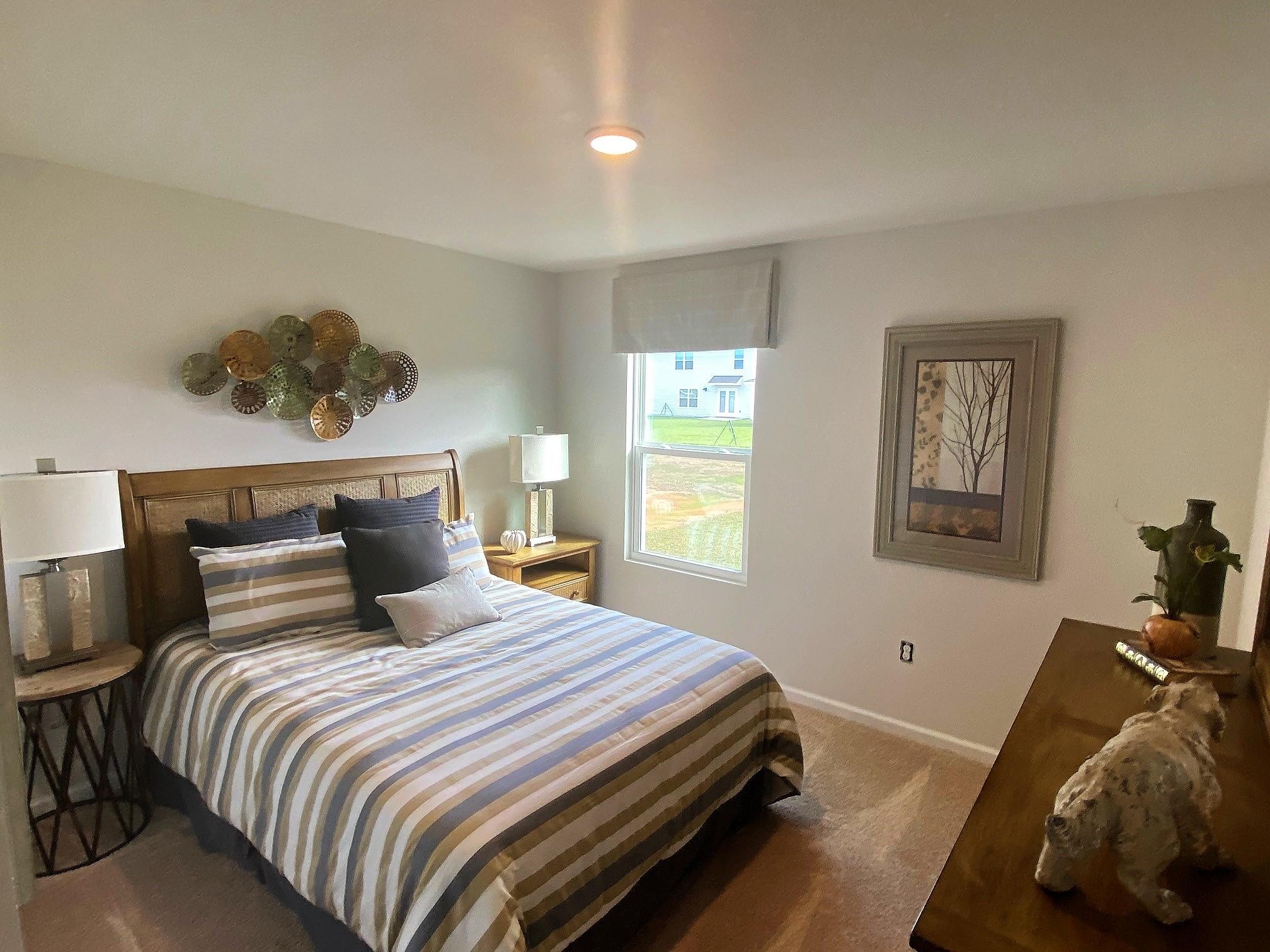 3262 Chapelwood Drive Crestview, FL 32539 - Photo 11 of 15 a bedroom with a bed and window