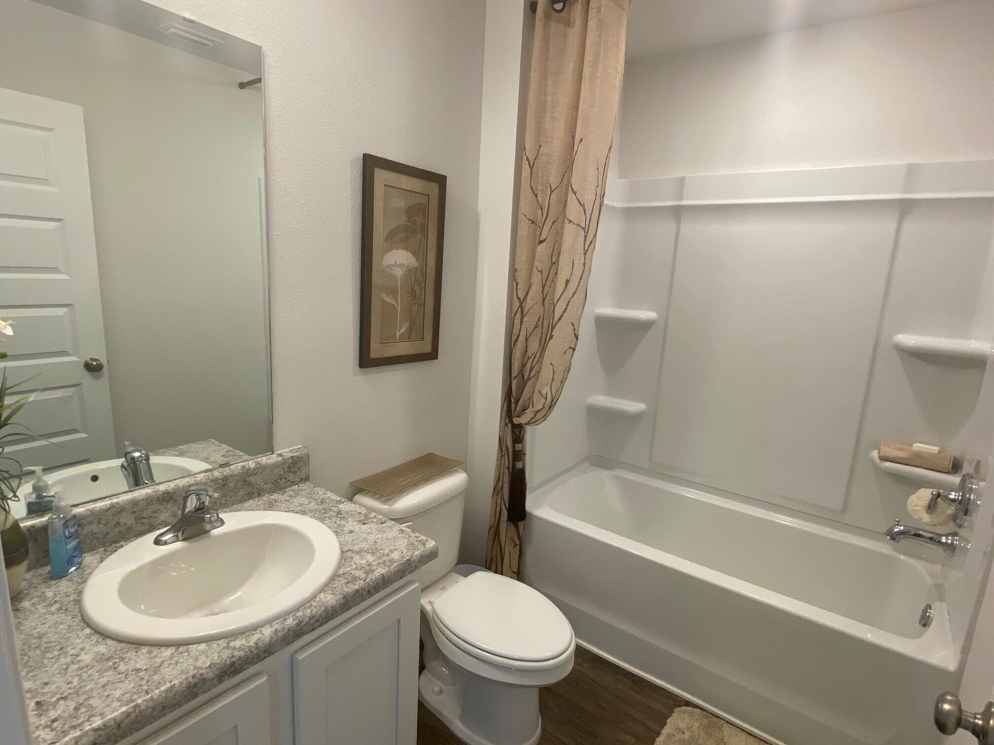3262 Chapelwood Drive Crestview, FL 32539 - Photo 13 of 15 a bathroom with a sink toilet and shower