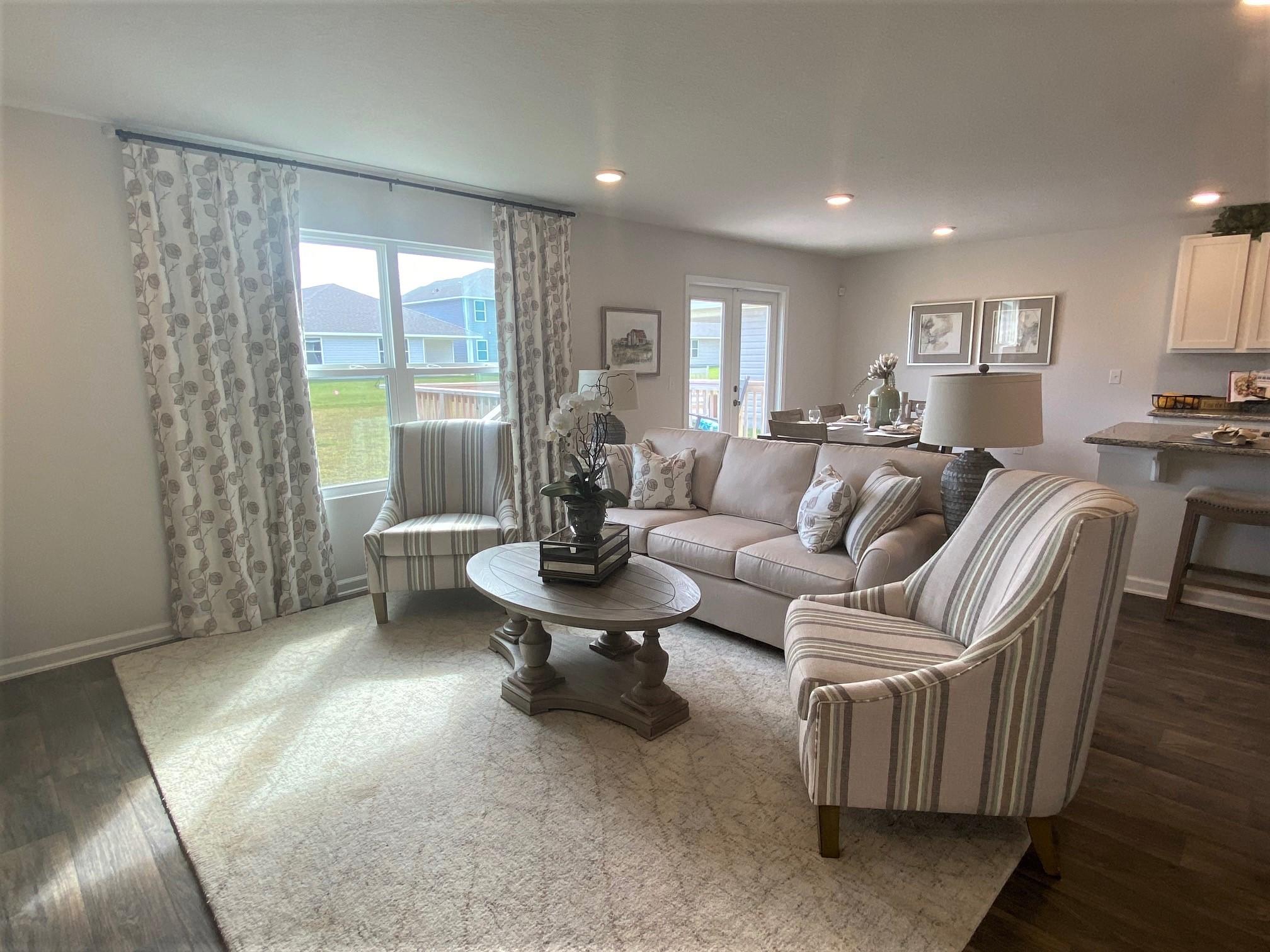 3262 Chapelwood Drive Crestview, FL 32539 - Photo 7 of 15 a living room with furniture and a large window