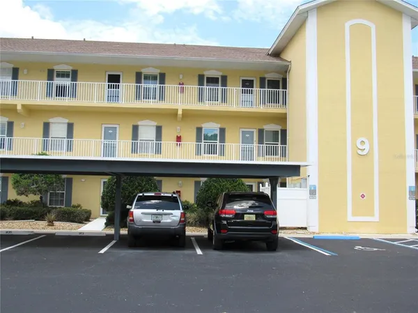 a view of a car parked in front of a building