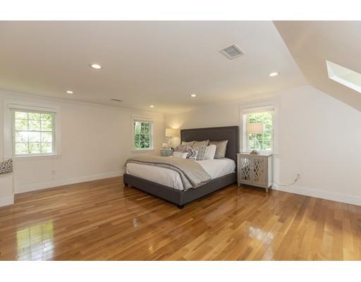 37 Tower Road Lexington, MA 02421 - Photo 13 of 20 a bedroom with a bed and wooden floor