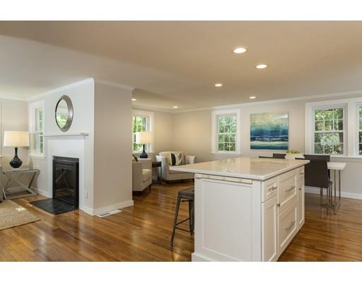 37 Tower Road Lexington, MA 02421 - Photo 5 of 20 a kitchen with a stove a refrigerator and a fireplace