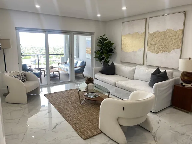 a bathroom with a granite countertop toilet sink and shower