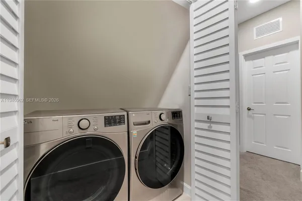 a utility room with dryer and washer