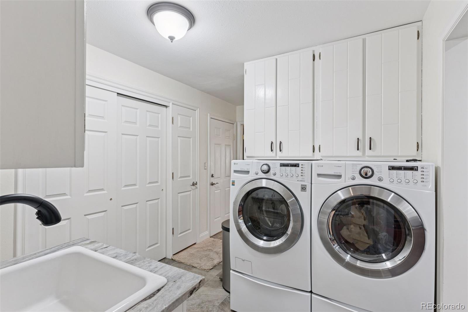 16990 Old Pueblo Road Fountain, CO 80817 - Photo 15 of 50 a utility room with dryer and washer