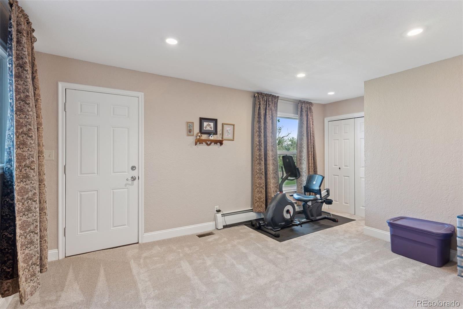 16990 Old Pueblo Road Fountain, CO 80817 - Photo 16 of 50 a view of room with gym equipment