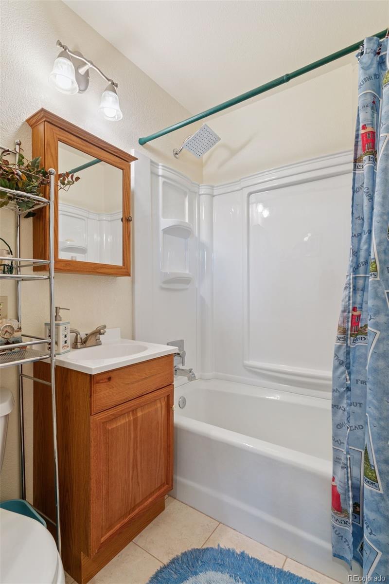 16990 Old Pueblo Road Fountain, CO 80817 - Photo 17 of 50 a bathroom with a granite countertop sink mirror vanity and bathtub