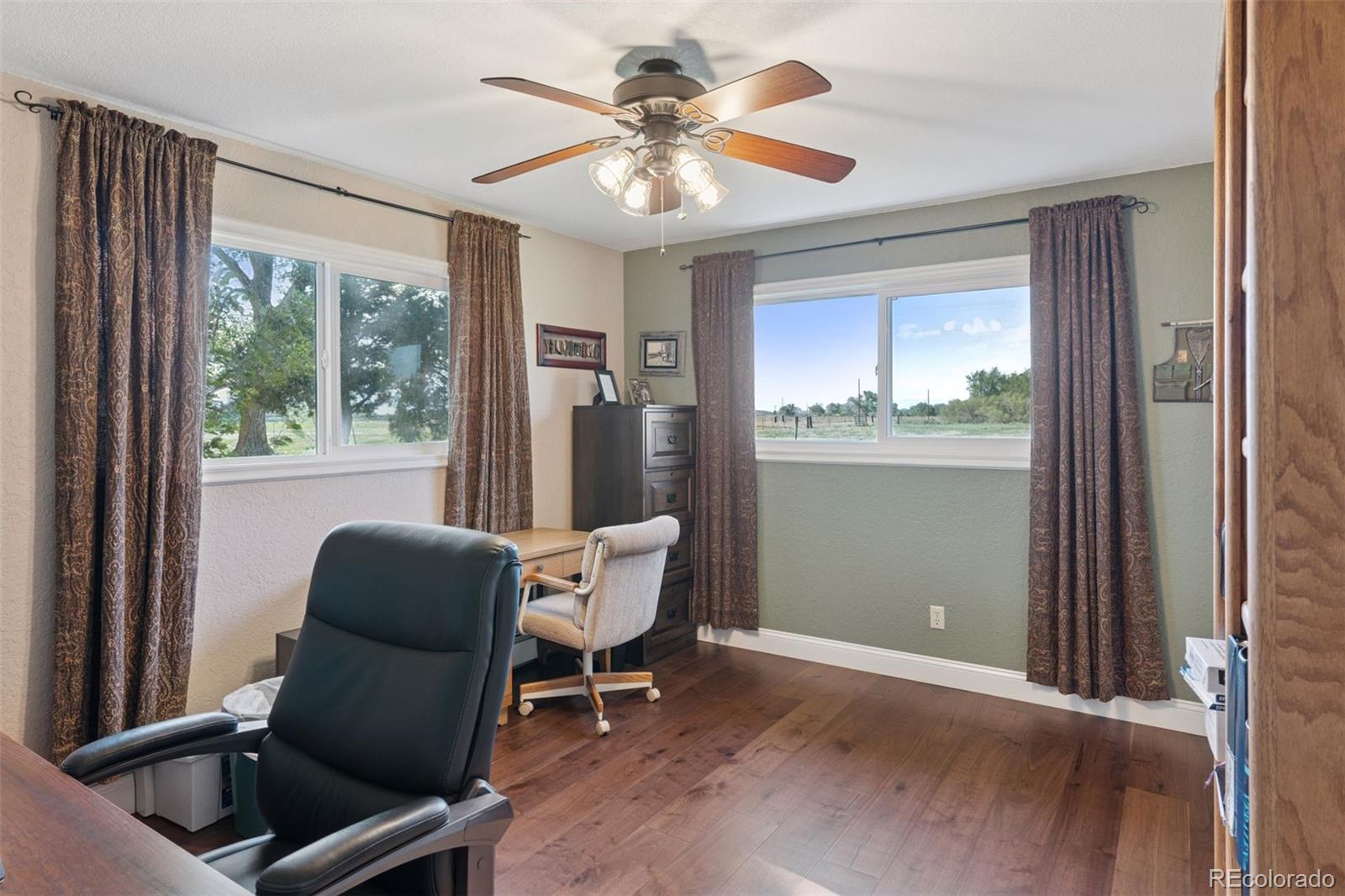 16990 Old Pueblo Road Fountain, CO 80817 - Photo 18 of 50 a living room with furniture and a window