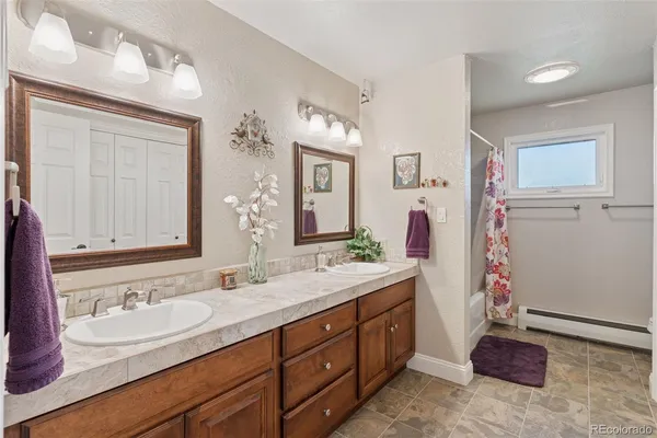a bathroom with a sink a vanity and a mirror