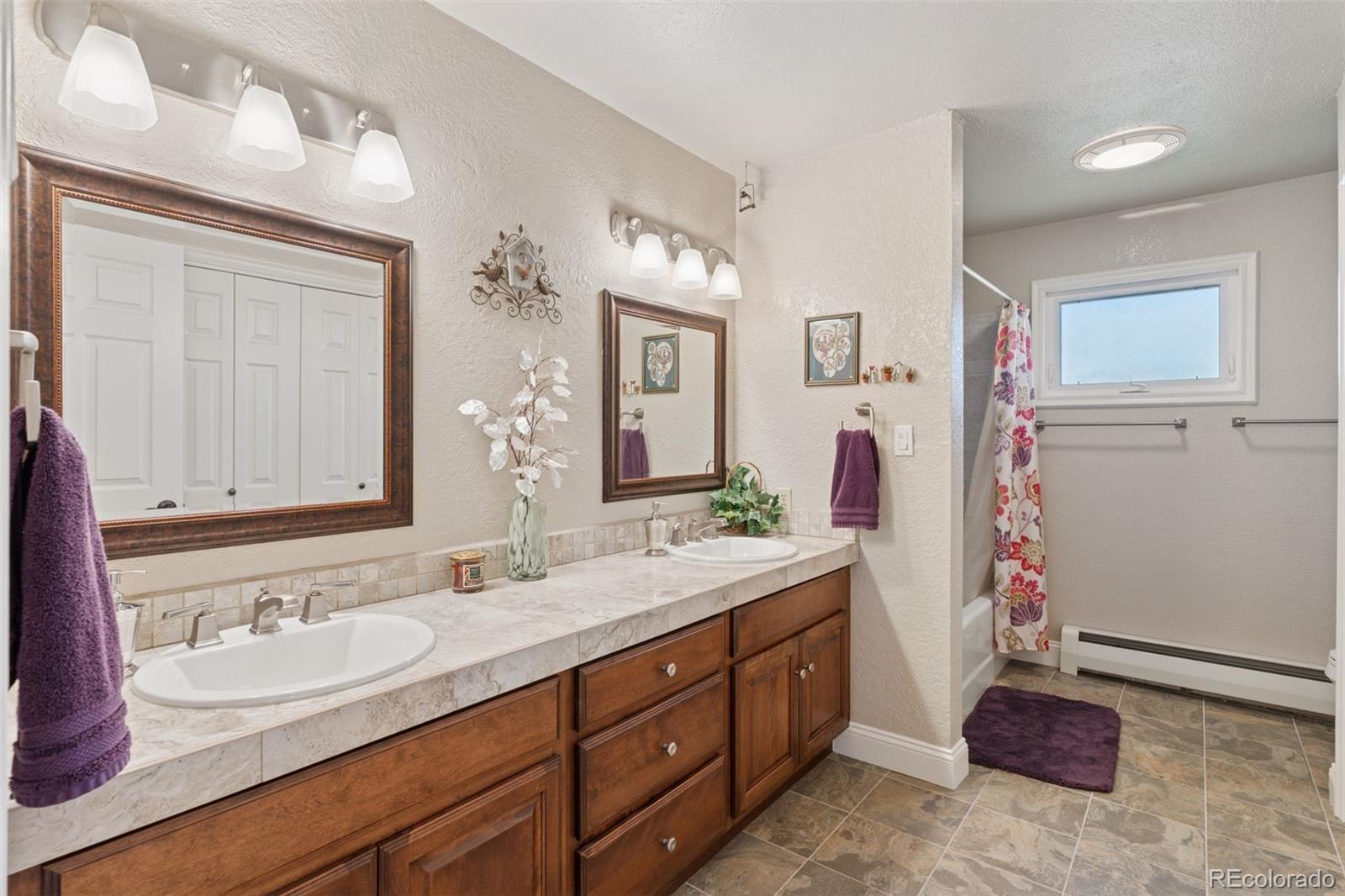 16990 Old Pueblo Road Fountain, CO 80817 - Photo 19 of 50 a bathroom with a sink a vanity and a mirror