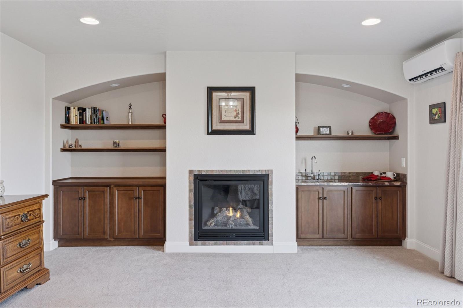 16990 Old Pueblo Road Fountain, CO 80817 - Photo 22 of 50 a living room with furniture and a fireplace