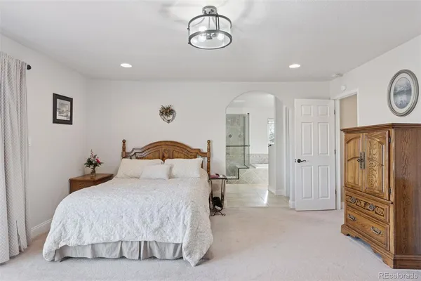 a bedroom with a bed and cabinets