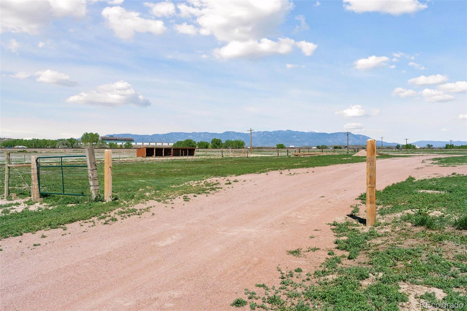 16990 Old Pueblo Road Fountain, CO 80817 - Photo 43 of 50 a view of a lake with houses in the back