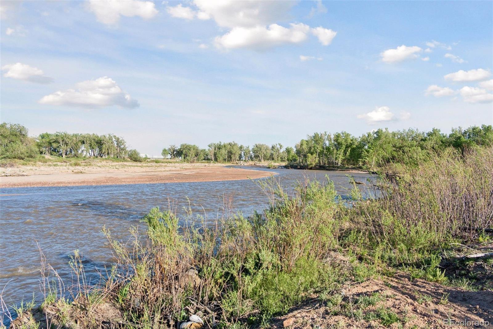 16990 Old Pueblo Road Fountain, CO 80817 - Photo 46 of 50 a view of a lake from a yard