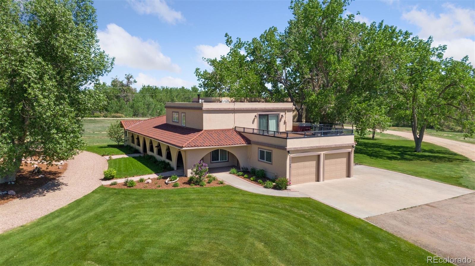 16990 Old Pueblo Road Fountain, CO 80817 - Photo 5 of 50 a front view of a house with garden