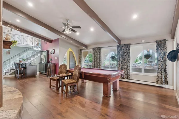 a room with lots of furniture and a large window