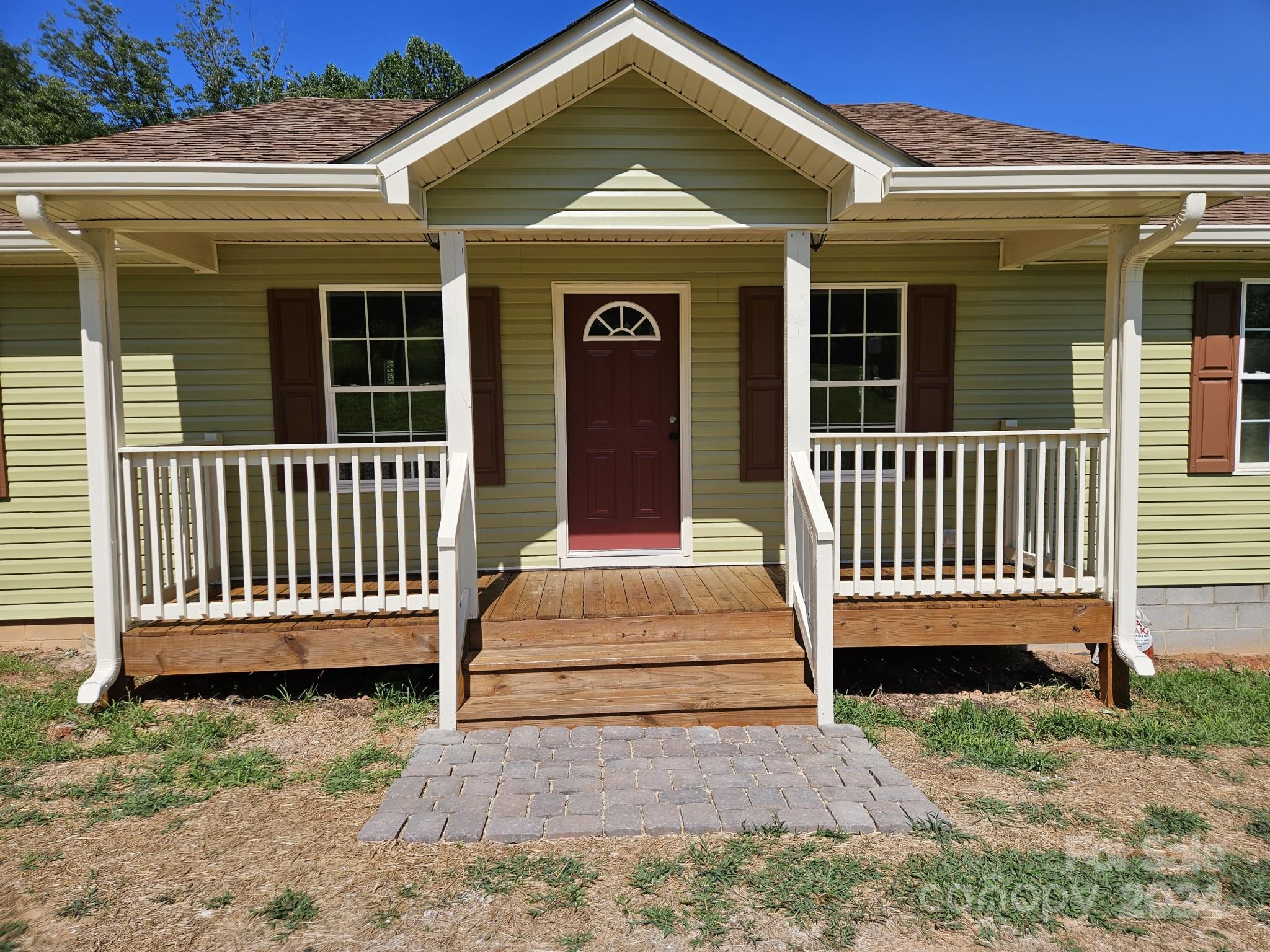 125 Diamond Loop Rutherfordton, NC 28139 - Photo 3 of 28 a view of a house with a small yard and wooden floor and fence