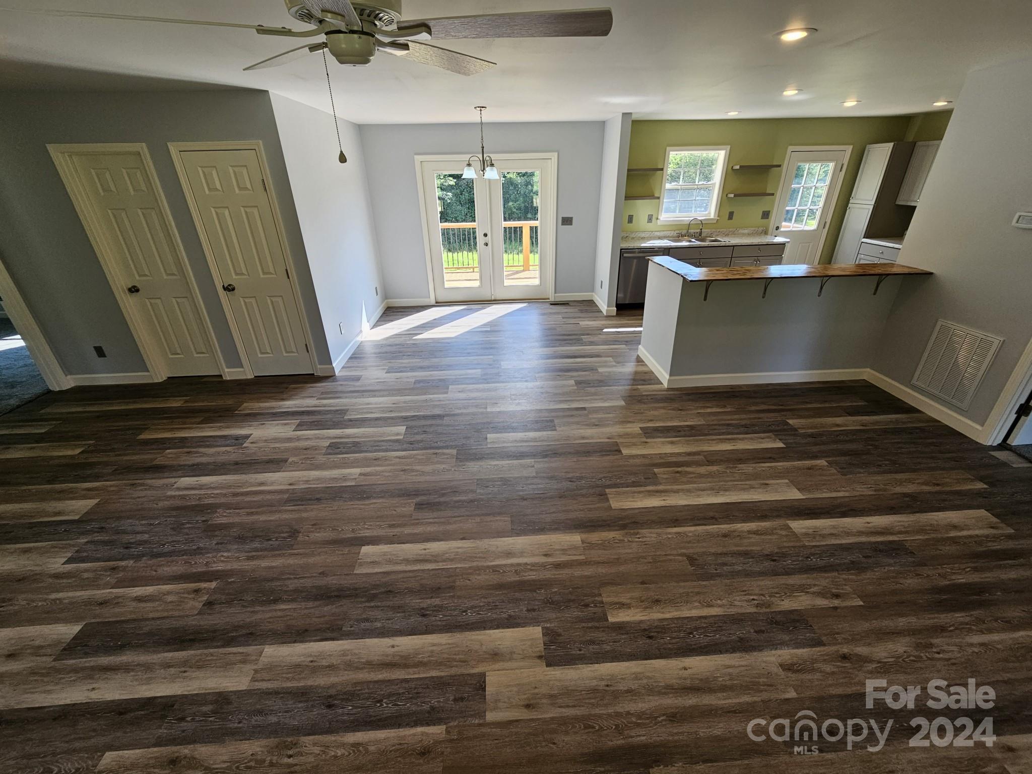 125 Diamond Loop Rutherfordton, NC 28139 - Photo 5 of 28 a view of kitchen and empty room with wooden floor