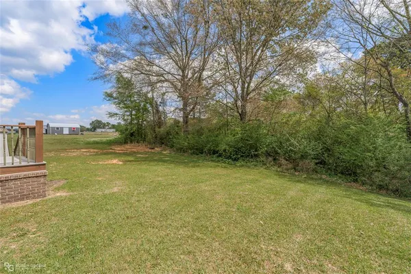 a view of a yard with an outdoor space