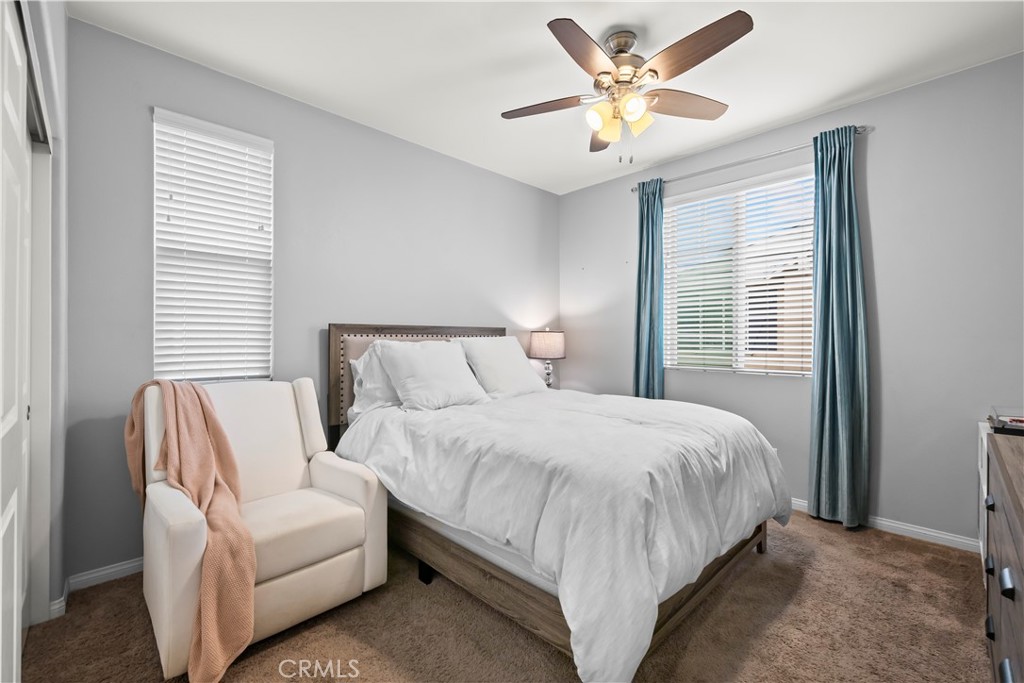 692 South Brampton Avenue Rialto, CA 92376 - Photo 13 of 21 a bedroom with bed and window