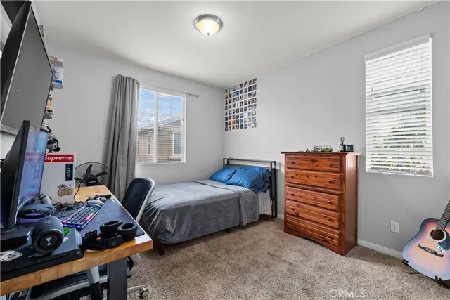 a bedroom with furniture and a window