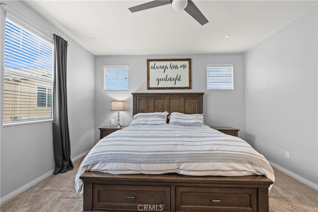 692 South Brampton Avenue Rialto, CA 92376 - Photo 16 of 21 a bedroom with a bed and a window