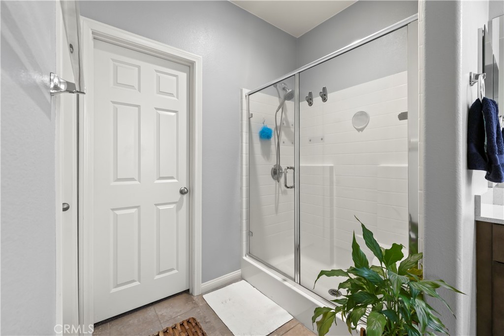 692 South Brampton Avenue Rialto, CA 92376 - Photo 18 of 21 a bathroom with a shower and a plant