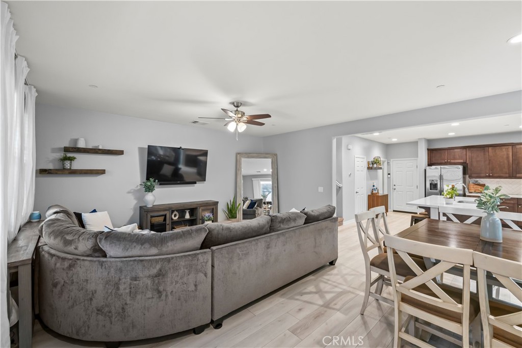 692 South Brampton Avenue Rialto, CA 92376 - Photo 6 of 21 a living room with furniture and a flat screen tv