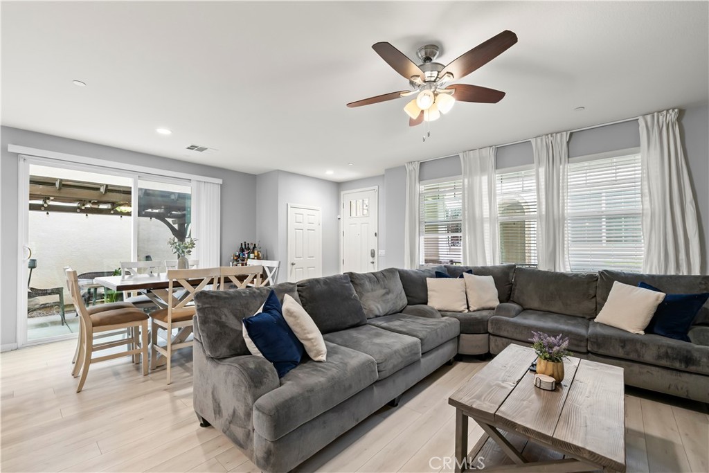 692 South Brampton Avenue Rialto, CA 92376 - Photo 8 of 21 a living room with furniture and a large window