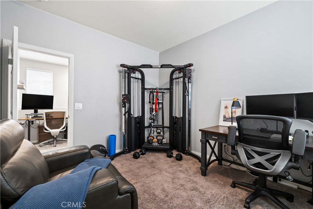 692 South Brampton Avenue Rialto, CA 92376 - Photo 10 of 21 a living room with furniture and a flat screen tv