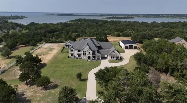 an aerial view of a house with a garden