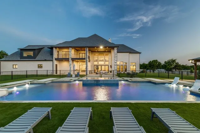 swimming pool view with a seating space