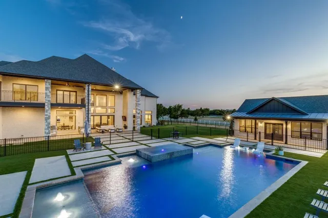 a view of a backyard with floor to ceiling window