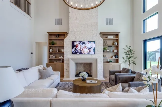a living room with furniture and a fireplace