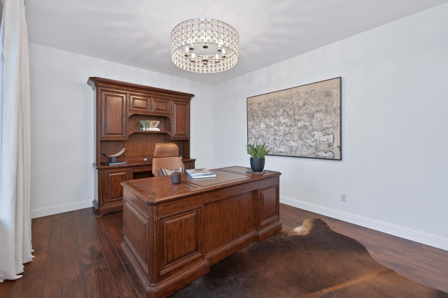 601 Decatur Avenue Clovis, CA 93611 - Photo 23 of 62 a room with a table chairs and a chandelier