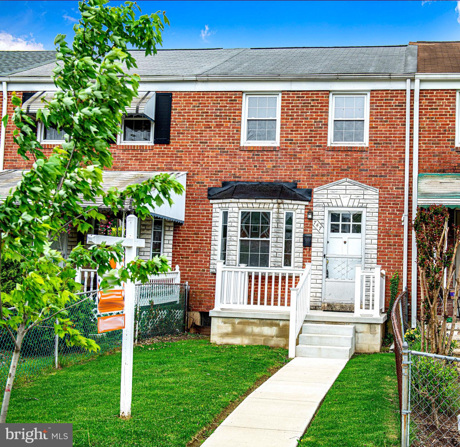 747 Middlesex Road Baltimore, MD 21221 - Photo 2 of 25 a front view of a house with a yard